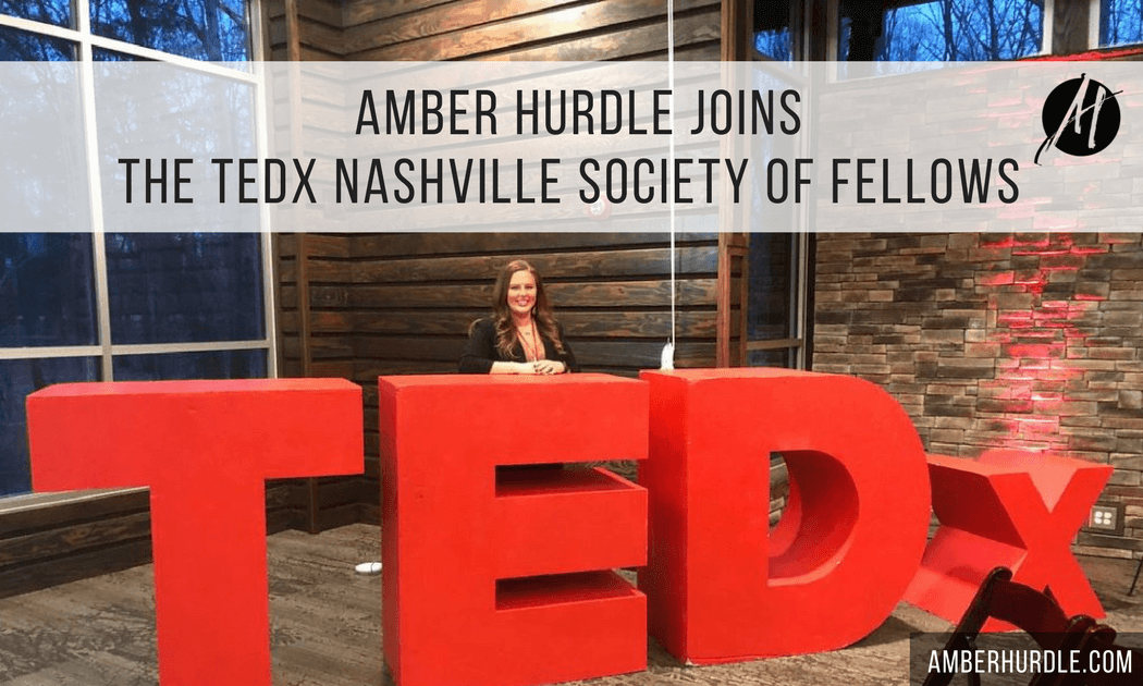 Amber Hurdle in front of TEDx sign